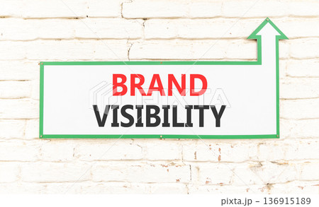 Brand visibility symbol. Concept words Brand visibility on beautiful big white sign plate. Beautiful old white stone wall background. Business branding and brand visibility concept. Copy space. 136915189