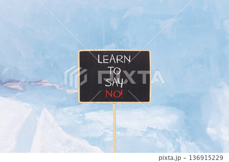 Learn to say no symbol. Concept words phrase Learn to say no on beautiful black blackboard. Beautiful blue ice background. Business psychological Learn to say no concept. Copy space. Learn to say no symbol. Concept words phrase Learn to say no on beautiful black blackboard. Beautiful blue ice background. Business psychological Learn to say no concept. Copy space. 136915229