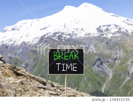 Break time symbol. Concept word Break time on beautiful black blackboard. Beautiful stone mountain Elbrus blue sky background. Black blackboard. Business break time concept. Copy space. Break time symbol. Concept word Break time on beautiful black blackboard. Beautiful stone mountain Elbrus blue sky background. Black blackboard. Business break time concept. Copy space. 136915230