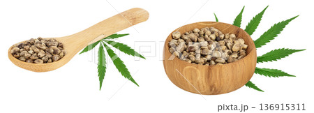 Hemp seeds with leaf in wooden spoon and bowl isolated on white background with full depth of field 136915311