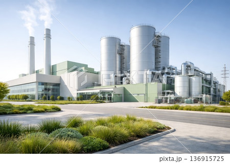 Modern industrial power plant facility with storage tanks and smokestacks in clean energy infrastructure Modern industrial power plant facility with storage tanks and smokestacks in clean energy infrastructure 136915725