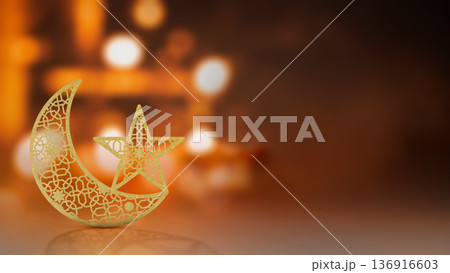 A golden glittery crescent moon and star ornament featuring intricate geometric patterns set against a warm, festive bokeh light background with ample copy space 136916603