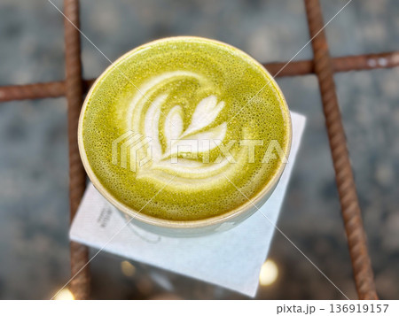 Matcha latte with foam art in ceramic cup. Mindful ritual, cafe culture, wellness habit, slow living lifestyle Matcha latte with foam art in ceramic cup. Mindful ritual, cafe culture, wellness habit, slow living lifestyle 136919157