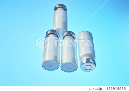 Vials with medication powder on blue background 136919686