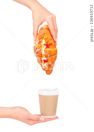 Sweet croissant with cream and jam over takeaway coffee Sweet croissant with cream and jam over takeaway coffee 136919712