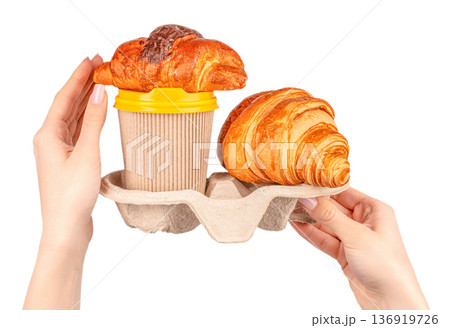 Takeaway coffee with croissants in cardboard holder 136919726