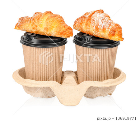 Two takeaway coffee cups with croissants in carrier holder Two takeaway coffee cups with croissants in carrier holder 136919771