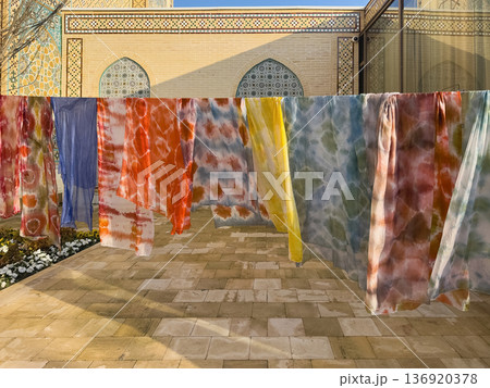 Row of colorful clothes hanging on a line. Samarkand 136920378