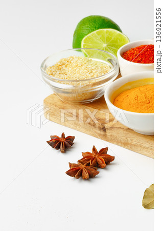 Cooking ingredients on a wooden board with lime and spices ready for a recipe Cooking ingredients on a wooden board with lime and spices ready for a recipe 136921556