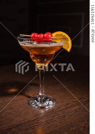A champagne cocktail in a beautiful glass with A champagne cocktail in a beautiful glass with 136921951