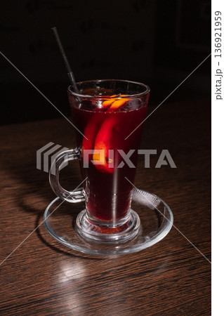 Mulled wine in a glass on a wooden table Mulled wine in a glass on a wooden table 136921959