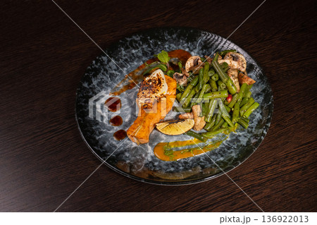 Fried salmon with vegetables and mushrooms Fried salmon with vegetables and mushrooms 136922013
