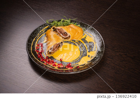 Pancakes with meat filling and sauce Pancakes with meat filling and sauce 136922410