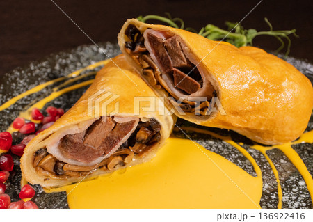 Pancakes with meat filling and sauce Pancakes with meat filling and sauce 136922416