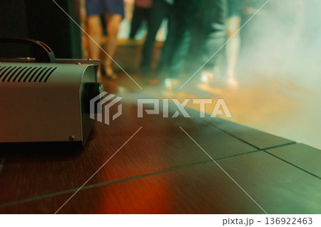 Smoke comes out of a smoke machine at a restaurant Smoke comes out of a smoke machine at a restaurant 136922463