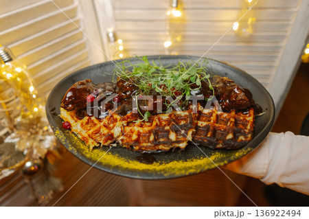 Meat with potato waffles on a plate Meat with potato waffles on a plate 136922494