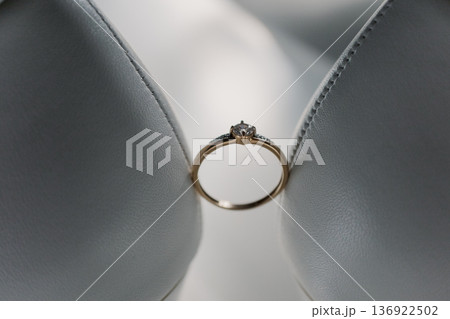 Wedding gold rings on the bride's shoes Wedding gold rings on the bride's shoes 136922502