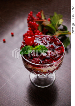 Dessert of pickled cherries with cream in a glass Dessert of pickled cherries with cream in a glass 136922656