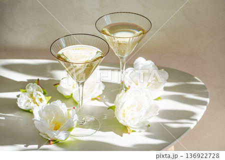 Champagne Glasses with White Peonies. Birthday or Wedding Celebration Arrangement 136922728