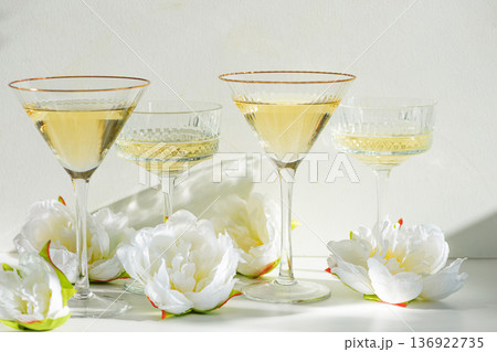 Champagne Glasses with White Peonies. Birthday or Wedding Celebration Arrangement 136922735