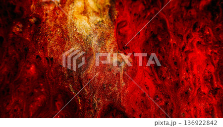 Shimmering mix. Ink stream defocused. Yellow red black sparkling color particles blending on abstract magma leak texture background. Shimmering mix. Ink stream defocused. Yellow red black sparkling color particles blending on abstract magma leak texture background. 136922842