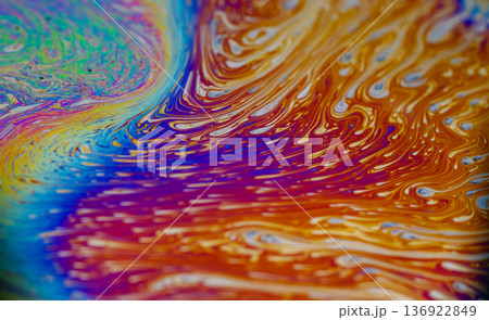 Ink wave blur. Swirl soap. Bright color pigment drop curve gasoline flow. Red orange blue oil liquid stream abstract background texture. 136922849