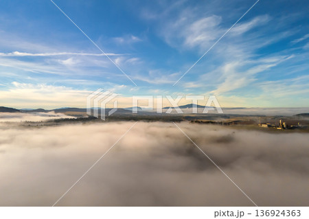 Aerial view of foggy landscape with Klet mountain in South Bohemia, Czech Republic Aerial view of foggy landscape with Klet mountain in South Bohemia, Czech Republic 136924363