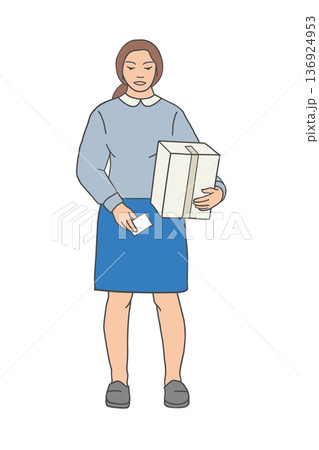Woman applying shipping label to cardboard box, front view. Woman applying shipping label to cardboard box, front view. 136924953