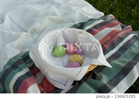 Basket with decorated easter eggs Basket with decorated easter eggs 136925205