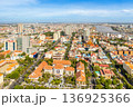 Modern residential areas and office buildings with Tonle Sap river in the background in rapidly developing Phnom Penh city panorama, Cambodia 136925366