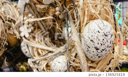 Decorative bird nest with speckled eggs, moss and dry twigs, rustic natural Easter background. Decorative bird nest with speckled eggs, moss and dry twigs, rustic natural Easter background. 136925819
