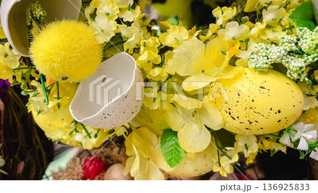 Festive Easter composition with a cute yellow chick, white eggshells and bright spring flowers. 136925833