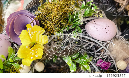 Beautiful Easter wreaths with spring flowers, speckled eggs and feathers, festive holiday decor. Beautiful Easter wreaths with spring flowers, speckled eggs and feathers, festive holiday decor. 136925835