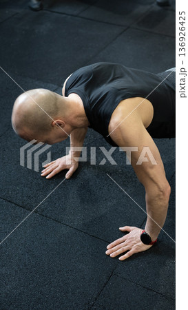 Athletic man doing push up close up strong arms Athletic man doing push up close up strong arms 136926425
