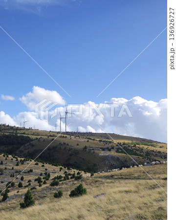Mountain pasture landscape with wind turbines Mountain pasture landscape with wind turbines 136926727
