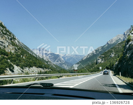 Mountain road view from inside car Mountain road view from inside car 136926728