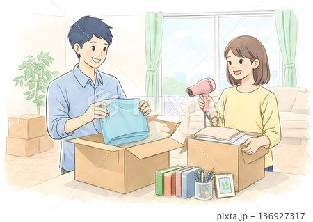 新生活に向けて笑顔で引っ越しの荷造りをする若いカップル 136927317
