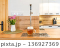 Draft beer pouring in a modern home kitchen bar 136927369