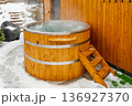 Steaming hot tub in winter garden with snow 136927370