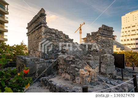 Historic mayan temple ruins in cancun mexico near hotels and construction Historic mayan temple ruins in cancun mexico near hotels and construction 136927470