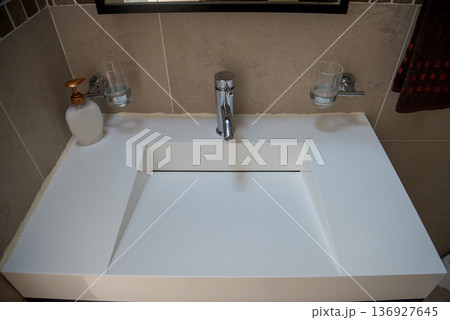 Contemporary white bathroom sink with integrated design Contemporary white bathroom sink with integrated design 136927645