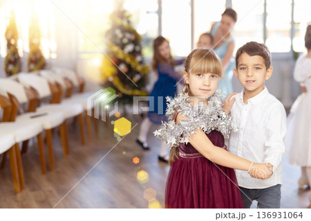 Tween boy and girl performing waltz during Christmas event at school Tween boy and girl performing waltz during Christmas event at school 136931064