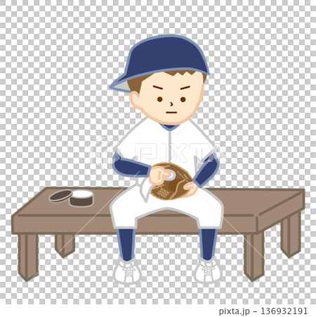 一個男孩反戴著棒球帽，正在擦拭他的棒球手套。 136932191