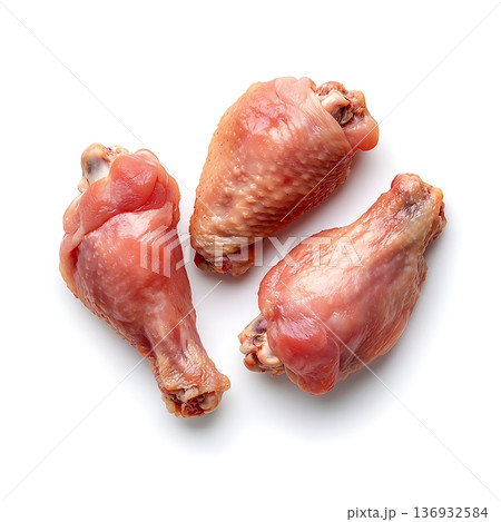Fresh Raw Chicken Drumsticks Isolated on White Surface for Cooking and Preparation 136932584