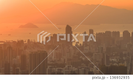 Jan 11 2026 Mong Kok cityscape with dense buildings under sunset glow 136932935