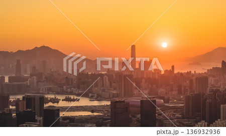 Jan 11 2026 Kowloon skyline glowing under warm golden sunset light Jan 11 2026 Kowloon skyline glowing under warm golden sunset light 136932936