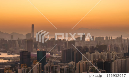 Jan 11 2026 Kowloon skyline glowing under warm golden sunset light Jan 11 2026 Kowloon skyline glowing under warm golden sunset light 136932957