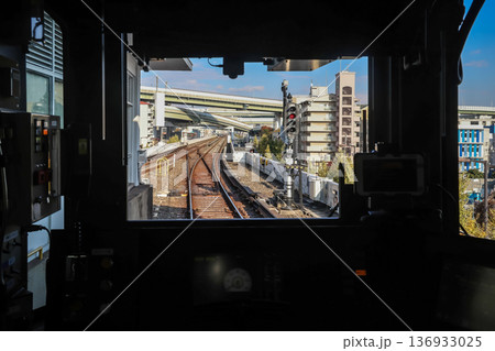 Nov 25 2025 Modern Osaka Subway Station with Commuters and Trains 136933025
