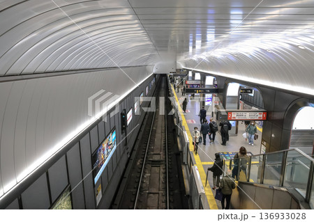 Nov 25 2025 Modern Osaka Subway Station with Commuters and Trains 136933028