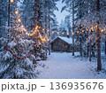 Christmas winter landscape with cozy log cabin in snowy forest decorated with warm string lights and pine tree 136935676